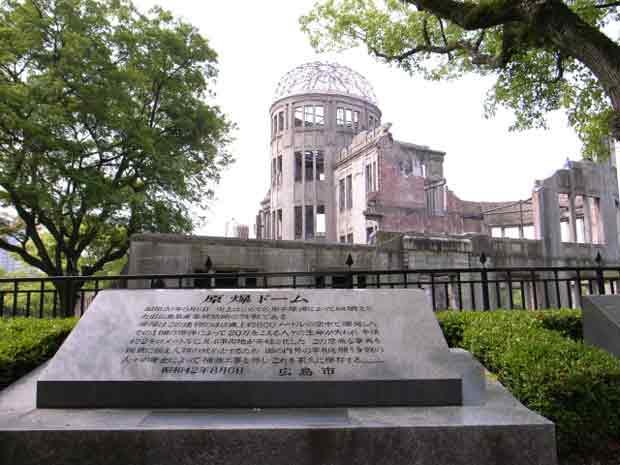 Photographic image of a historical plaque with the Hiroshima Dome in the background